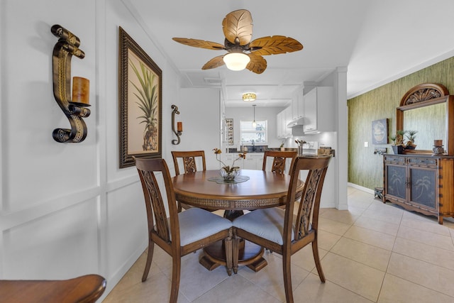 dining area with light tile patterned floors, baseboards, and ceiling fan