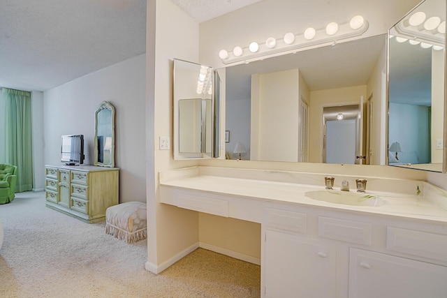 bathroom featuring vanity and baseboards