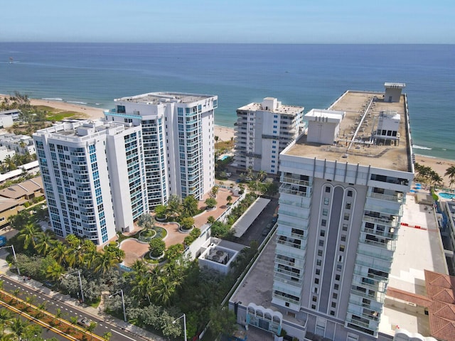 birds eye view of property featuring a city view and a water view