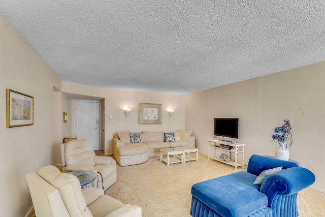 living area featuring carpet flooring and a textured ceiling