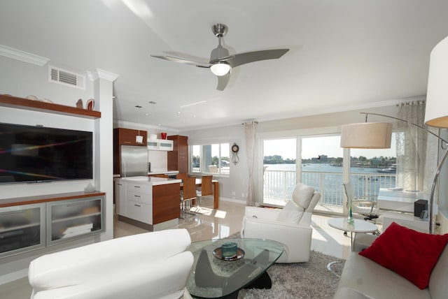 living room featuring visible vents, crown molding, and ceiling fan