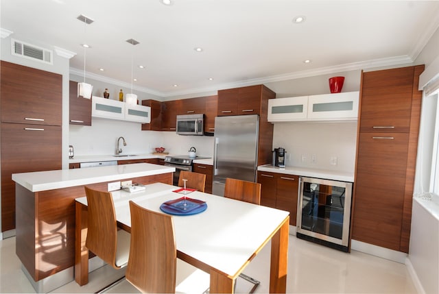 kitchen with modern cabinets, beverage cooler, and appliances with stainless steel finishes