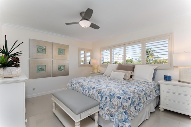 bedroom featuring crown molding, a ceiling fan, and baseboards