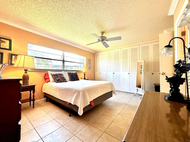 bedroom featuring a textured ceiling, light tile patterned flooring, ceiling fan, and ornamental molding