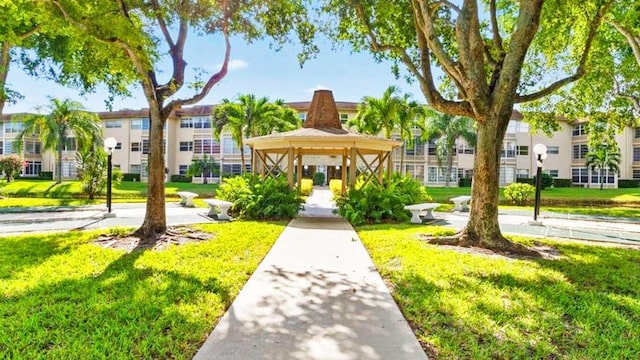 view of home's community featuring a yard