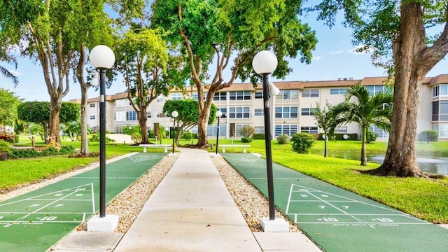 view of community featuring a yard and a residential view