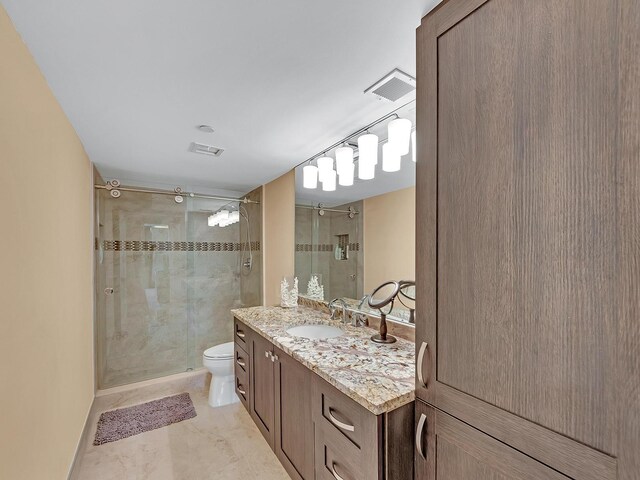 full bath with vanity, toilet, visible vents, and a stall shower