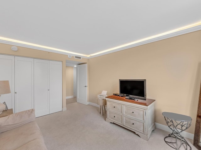 interior space with visible vents, light carpet, and baseboards