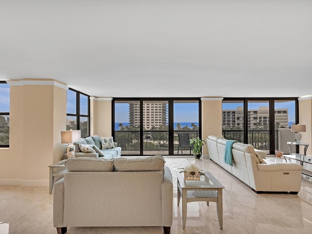 living area with a city view, floor to ceiling windows, baseboards, and a healthy amount of sunlight