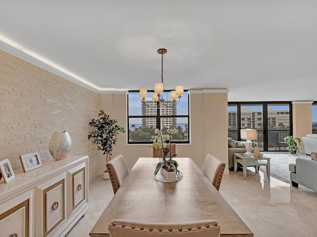 dining space featuring a wealth of natural light and an inviting chandelier