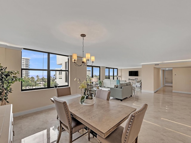 dining room with visible vents, baseboards, and a chandelier