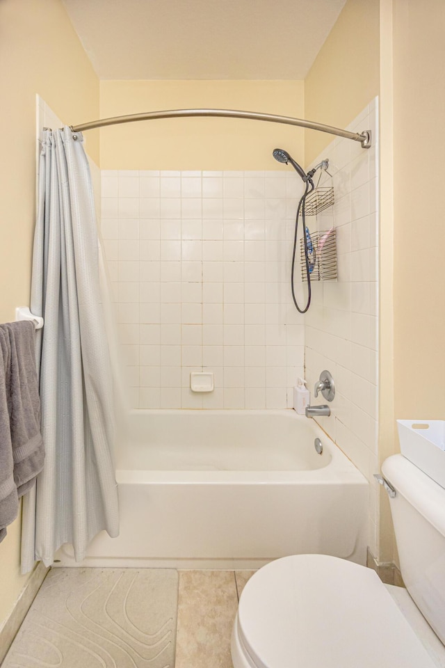 full bathroom featuring tile patterned flooring, toilet, and shower / tub combo with curtain