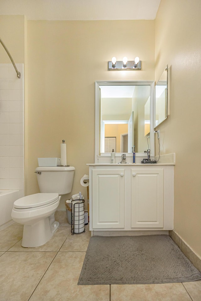 full bath featuring vanity, tile patterned floors, toilet, and bathing tub / shower combination