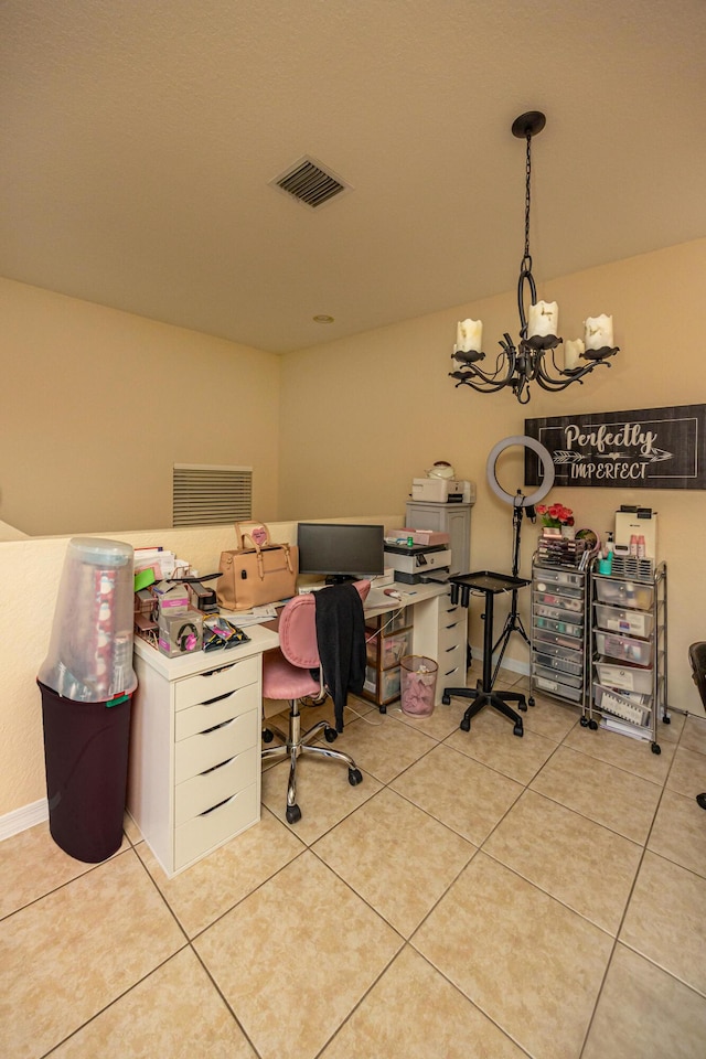 tiled office space with visible vents and a chandelier