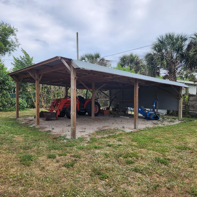 view of car parking featuring a detached carport and a pole building