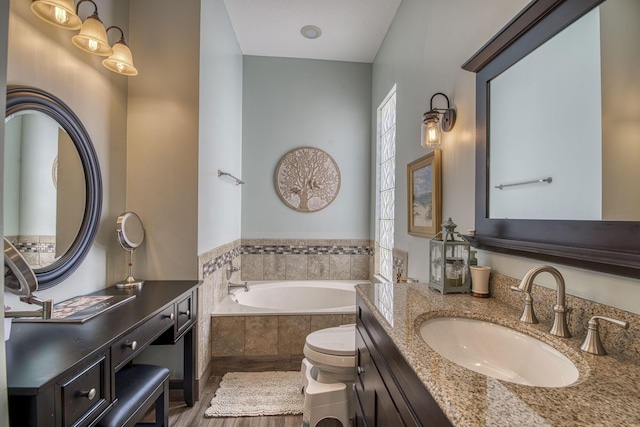 full bathroom featuring a sink, a garden tub, and two vanities