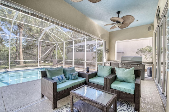 sunroom / solarium featuring ceiling fan