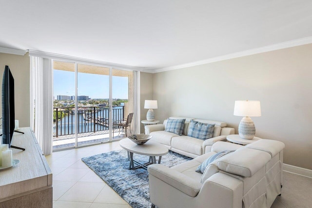 living area featuring a wall of windows, baseboards, ornamental molding, and light tile patterned flooring