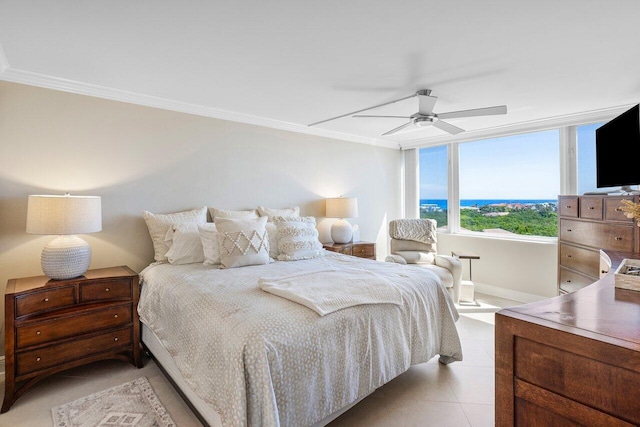 bedroom featuring light tile patterned floors, baseboards, crown molding, and a ceiling fan