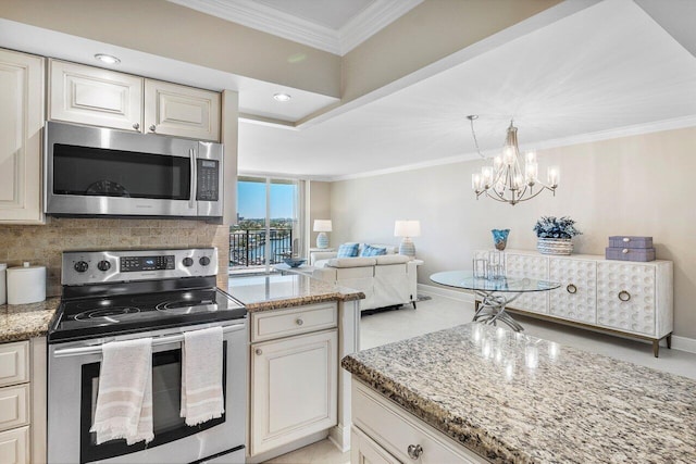 kitchen with open floor plan, stainless steel appliances, crown molding, decorative backsplash, and light stone countertops