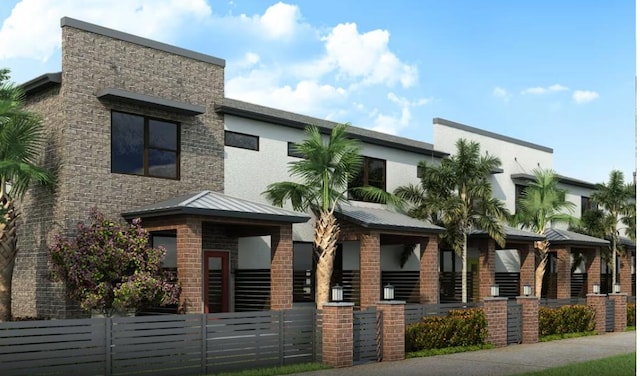 view of building exterior featuring a fenced front yard