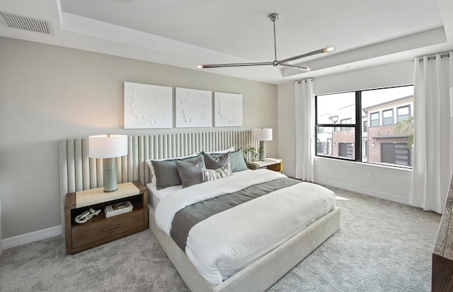 bedroom with visible vents, carpet floors, baseboards, and ceiling fan