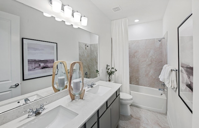 bathroom with toilet, shower / bath combo, visible vents, and a sink