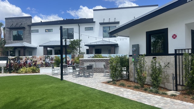 exterior space with a yard and a patio area