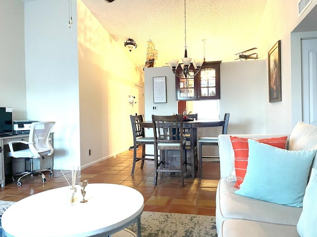 dining area featuring baseboards, visible vents, tile patterned flooring, a textured ceiling, and a chandelier