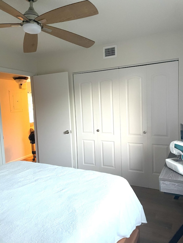 bedroom featuring a closet, visible vents, and ceiling fan