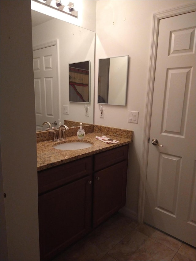 bathroom with vanity and tile patterned flooring