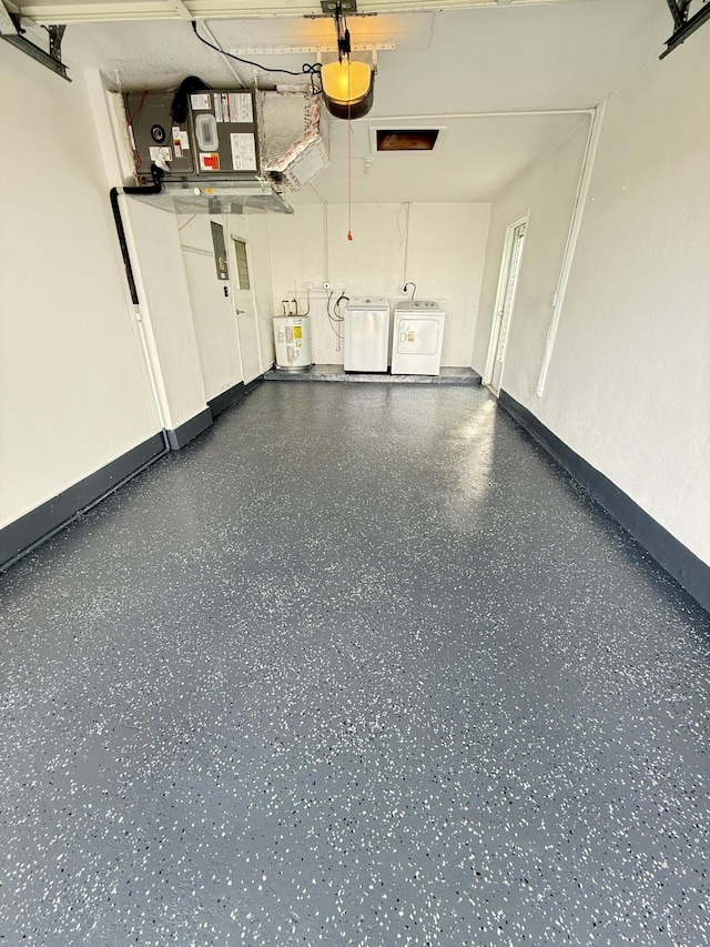 garage featuring washer and clothes dryer, water heater, baseboards, and a garage door opener