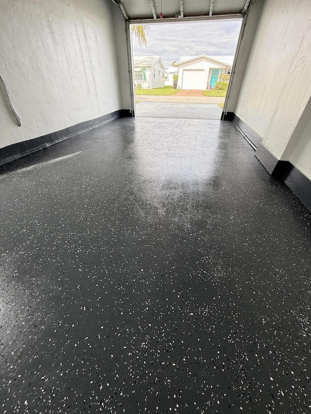 garage with baseboards