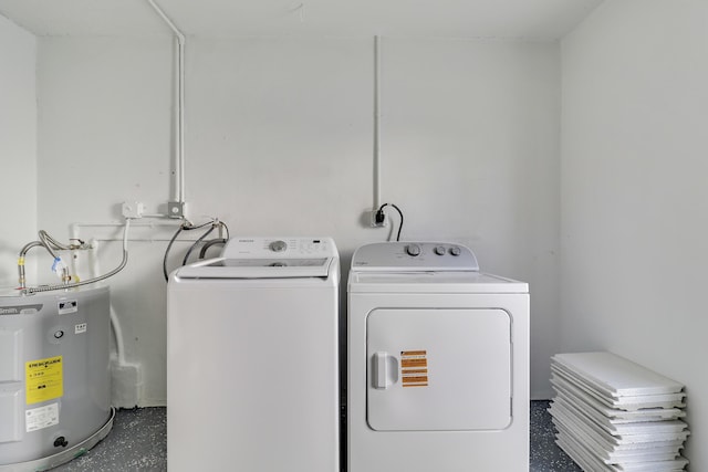 laundry room featuring washer and dryer, laundry area, and electric water heater