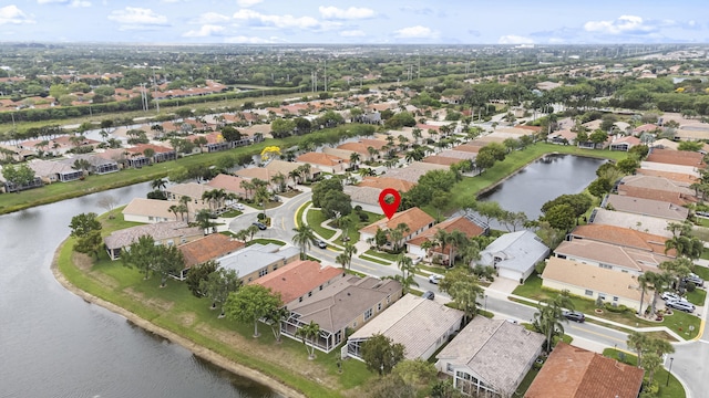 aerial view with a residential view and a water view