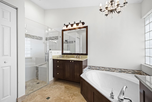 bathroom with a garden tub, a stall shower, and vanity