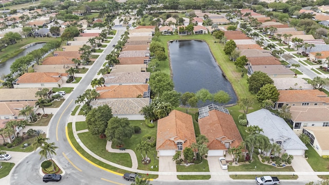 bird's eye view featuring a water view and a residential view