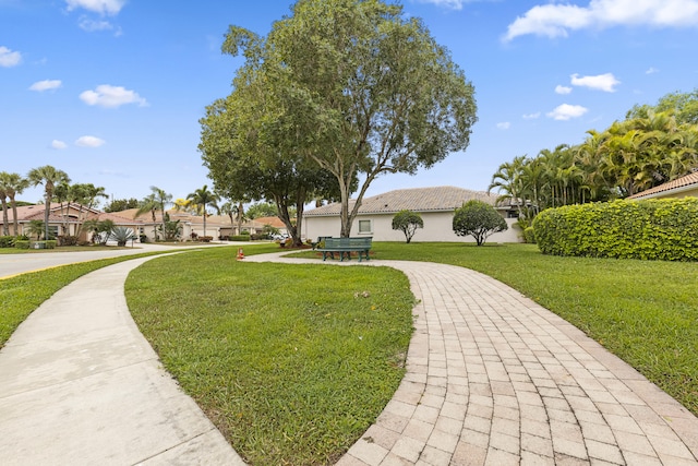 surrounding community featuring a residential view and a yard