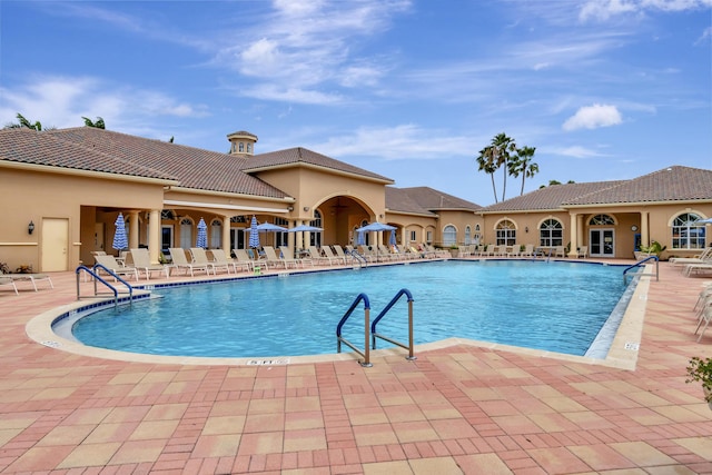 community pool with a patio