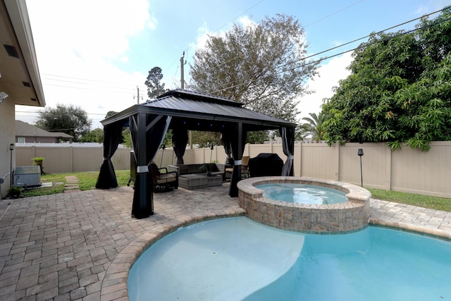 view of swimming pool featuring a patio, an in ground hot tub, a fenced backyard, a gazebo, and outdoor lounge area