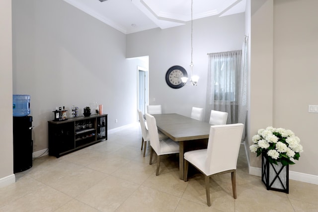 dining room featuring baseboards, a notable chandelier, light tile patterned flooring, and crown molding