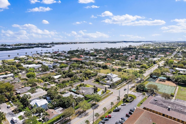 drone / aerial view with a residential view and a water view