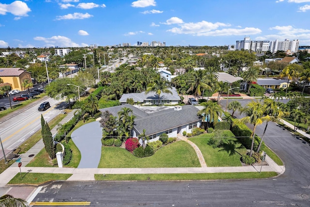 birds eye view of property with a view of city