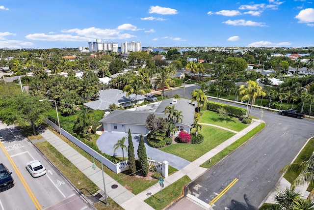 birds eye view of property featuring a city view