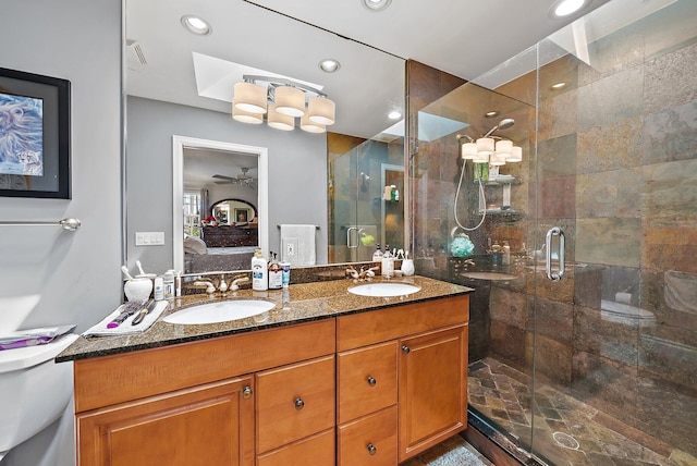 ensuite bathroom with a shower stall, ensuite bathroom, and a sink