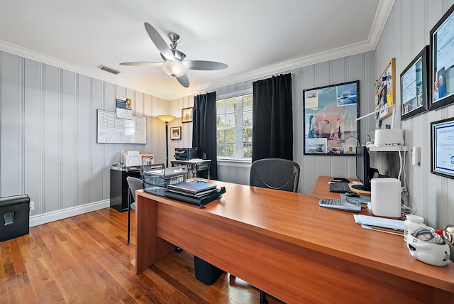 office with visible vents, baseboards, ceiling fan, ornamental molding, and wood finished floors