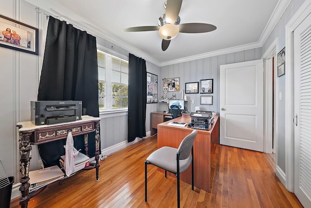 office space featuring a ceiling fan, light wood finished floors, and ornamental molding