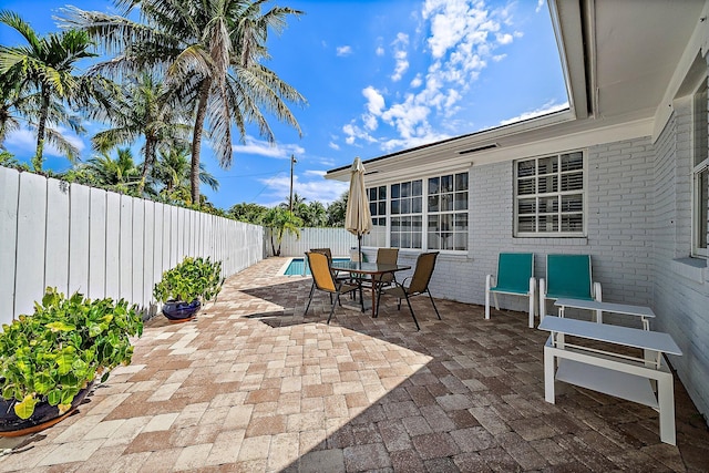 view of patio / terrace with a fenced backyard and outdoor dining space