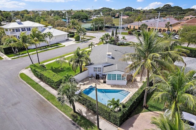 outdoor pool with a fenced backyard