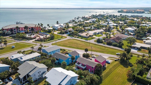 drone / aerial view with a residential view and a water view